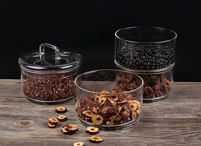 Stacked glass storage jars